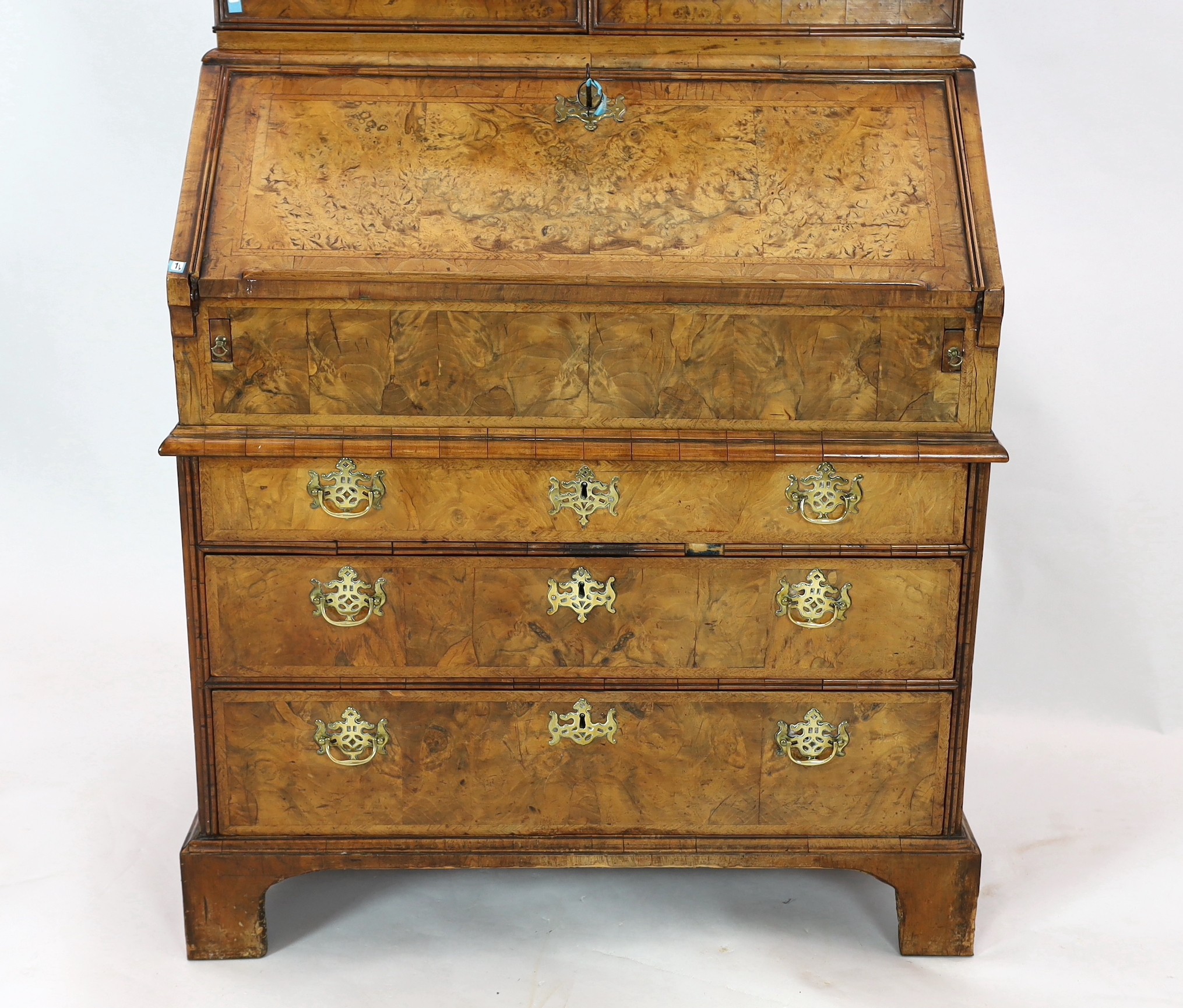 A George I walnut bureau bookcase, width 99cm, depth 62cm, height 196cm